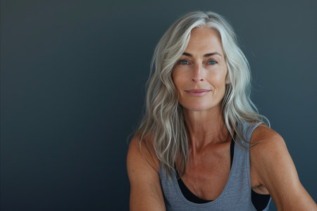 a woman with gray hair and a gray tank topの素材