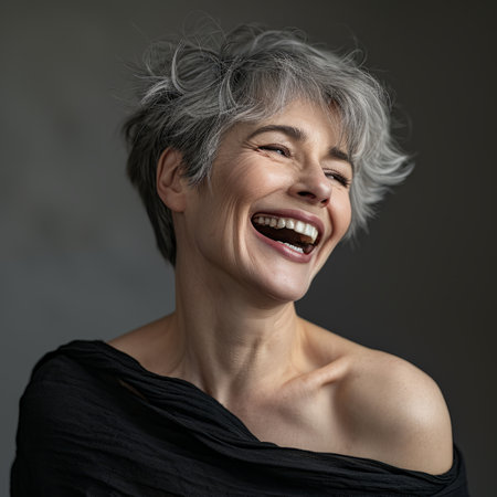 a woman with gray hair laughing and smilingの素材