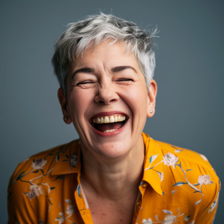 a woman with gray hair laughing and smilingの素材