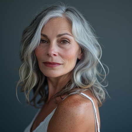 an older woman with gray hair posing for the cameraの素材