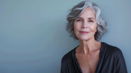 an older woman with gray hair posing for the cameraの素材
