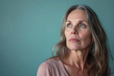 an older woman with gray hair looking to the sideの素材