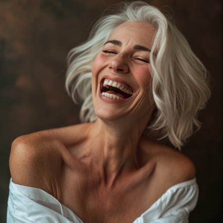 a woman with white hair laughingの素材