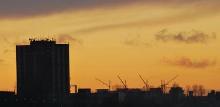 Industrial landscape with cranes at eveningの写真素材
