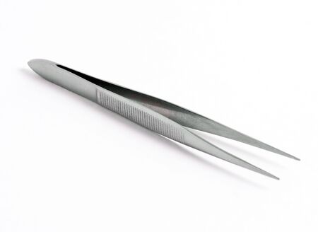 Stainless steel cosmetic and medicine tweezers on white background with shadowの写真素材