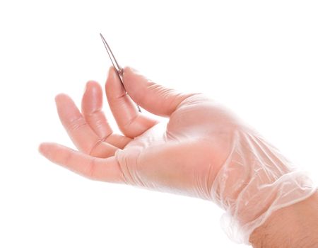 hand in rubber glove holding tweezers isolated on whiteの写真素材