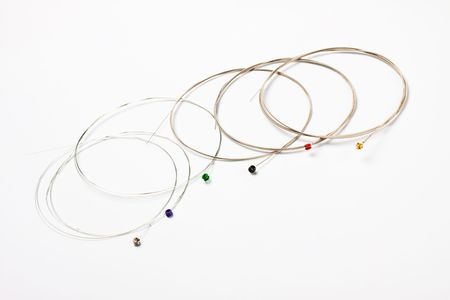guitar nickel strings on grey background