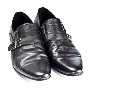black male shoes with buckles isolated on whiteの写真素材