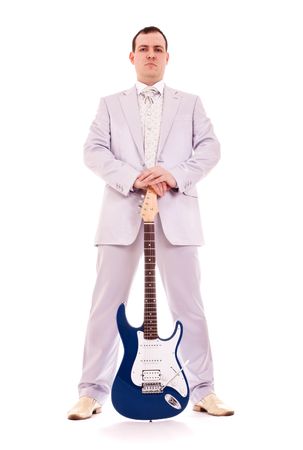 man standing with electro guitar on white backgroundの写真素材