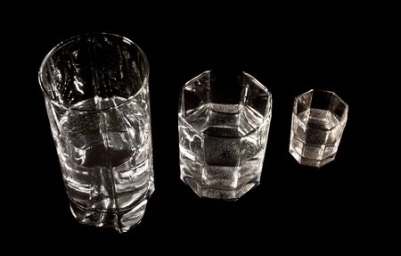 three different glasses on black backgroundの写真素材