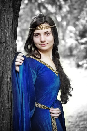 sad elf princess in winter forestの写真素材