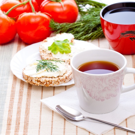 diet breakfast with tea and corn breadの写真素材