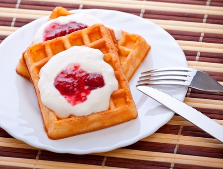 dessert with soft waffle, tea and raspberry jamの写真素材