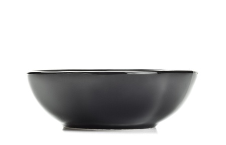 black salad bowl isolated on white backgroundの写真素材