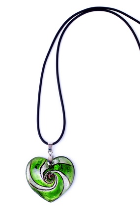 green heart-shaped pendant isolated on white backgroundの写真素材