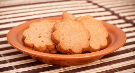dish of cinnamon cookies on bamboo napkinの写真素材
