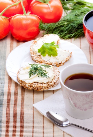 diet breakfast with tea and corn breadの写真素材