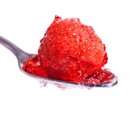 strawberry jelly on spoon isolated on white backgroundの写真素材