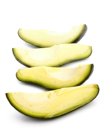 three avoñado slices isolated on white backgroundの写真素材
