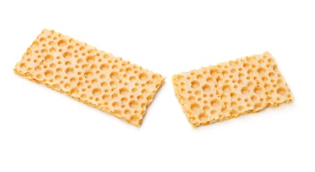 broken crunchy cracker isolated on white backgroundの写真素材