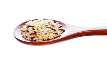 rice blend in wooden spoon isolated on white backgroundの写真素材