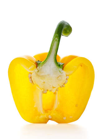 yellow paprika half isolated on white backgroundの写真素材