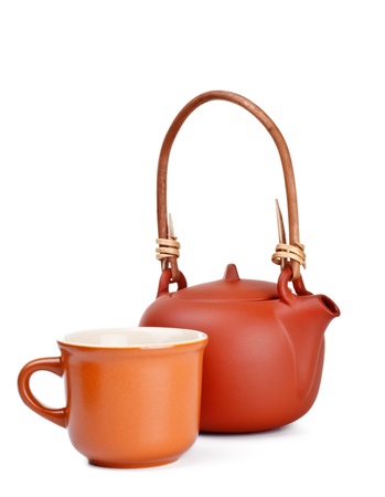 clay kettle and cup isolated on whiteの写真素材
