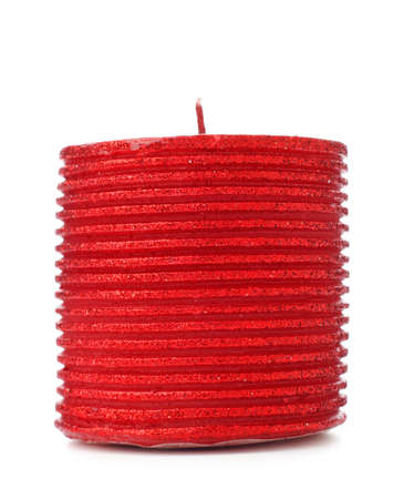 thick red christmas candle isolated on white backgroundの写真素材