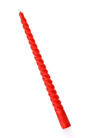 red twisted candle isolated on white backgroundの写真素材