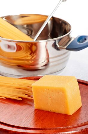 spaghetti, chees and kitchen utensil on tableの写真素材