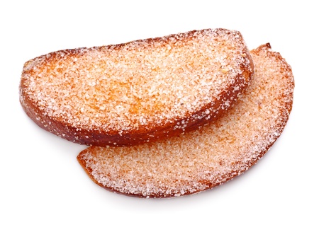 two rusks in sugar side isolated on whiteの写真素材