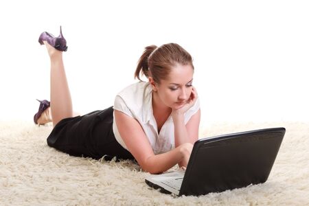 woman laying on floor with laptop computerの写真素材