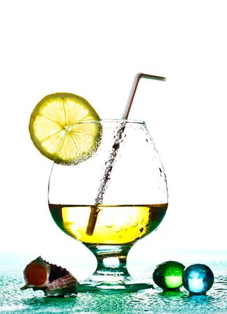 cocktail in glass with slice of limeの写真素材