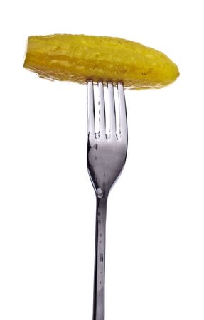 fresh pickle on fork isolated on white backgroundの写真素材