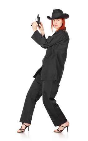 woman in black kimono with gun, isolated on whiteの写真素材
