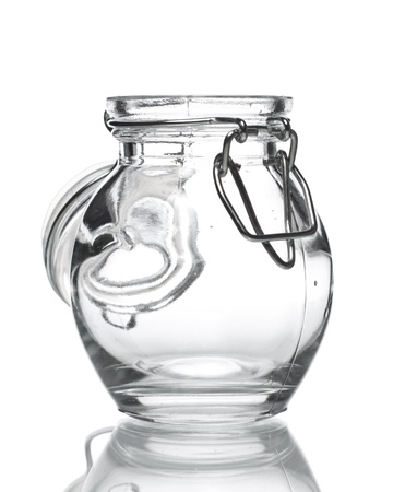 empty glass jar for spice isolated on whiteの写真素材