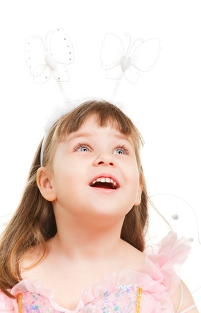 surprised little girl looking up, isolated on whiteの写真素材