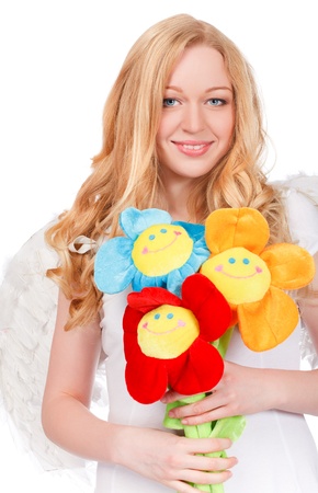 portrait of pretty smiling woman with funny artificial flowersの写真素材