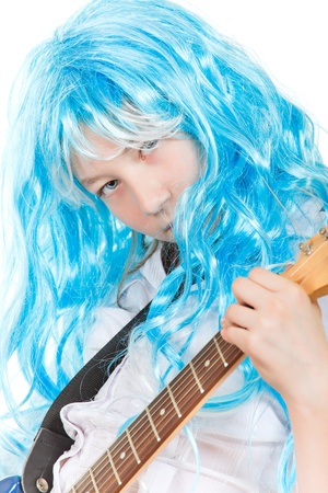 teenager girl rockstar in blue wig, isolated on whiteの写真素材