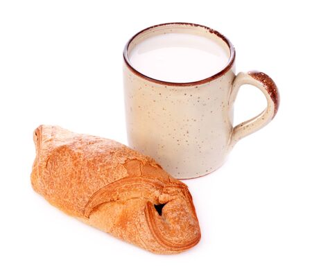 crispy bun and mug of milk isolated on whiteの写真素材