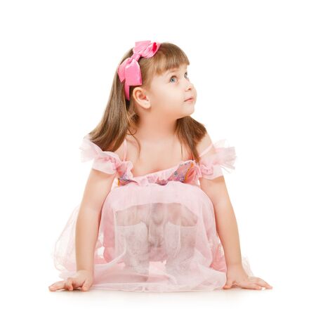 little girl looking up isolated on white backgroundの写真素材