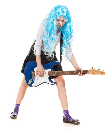 teen girl playing on a guitar, isolated on whiteの写真素材