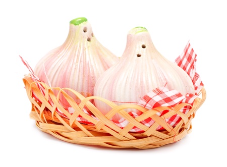 garlic shaped pepper and salt castors isolated on whiteの写真素材