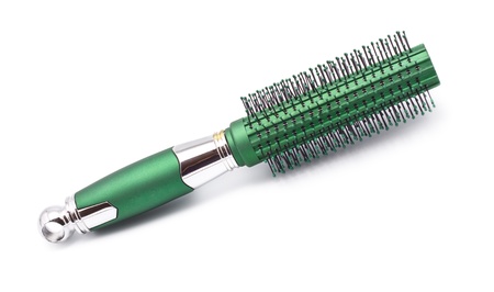 green hair brush isolated on white background
