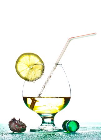 cocktail in glass with slice of limeの写真素材