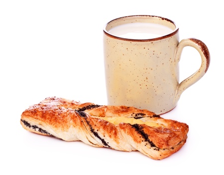 poppy pie and mug of milk isolated on whiteの写真素材