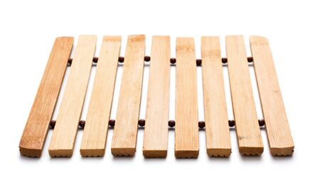 square, wooden trivet isolated on white backgroundの写真素材