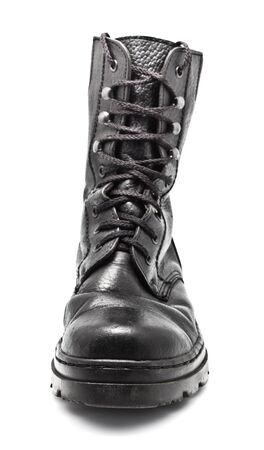black leather army boot isolated on whiteの写真素材