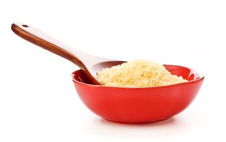 red bowl with rice and wooden spoonの写真素材
