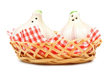 garlic shaped pepper and salt castors isolated on whiteの写真素材